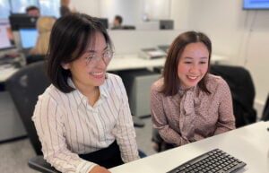 Support team around computer